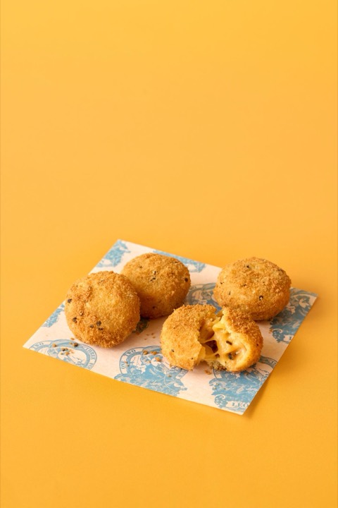 Cheddar & Black Pepper Mac Bites from the LEON menu